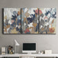 Three-panel canvas wall art featuring abstract flower stand composition, displayed above a desk in a home office.