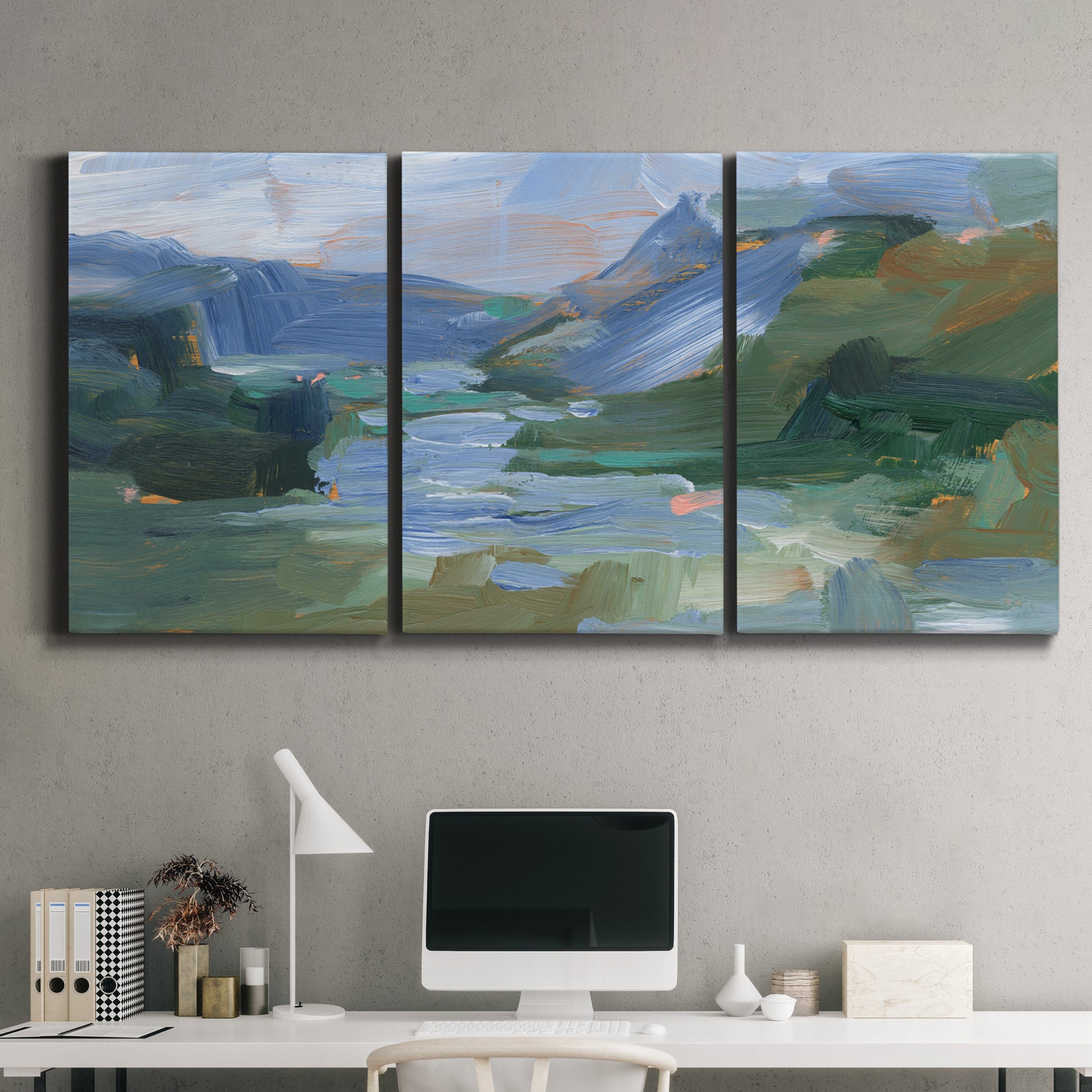 Three-panel canvas wall art featuring abstract landscape composition study, displayed above a desk in a home office.