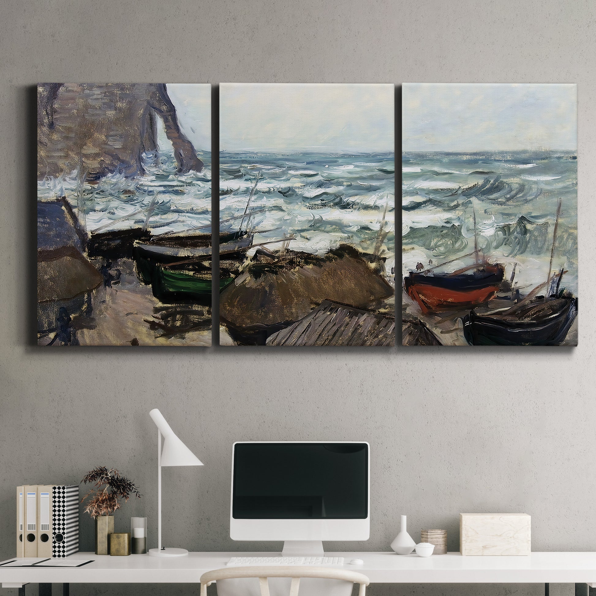 Three-panel canvas wall art featuring rough coastal seas under storm clouds, displayed above a desk in a home office.