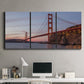 Three-panel canvas wall art featuring golden gate bridge spanning bay, displayed above a desk in a home office.