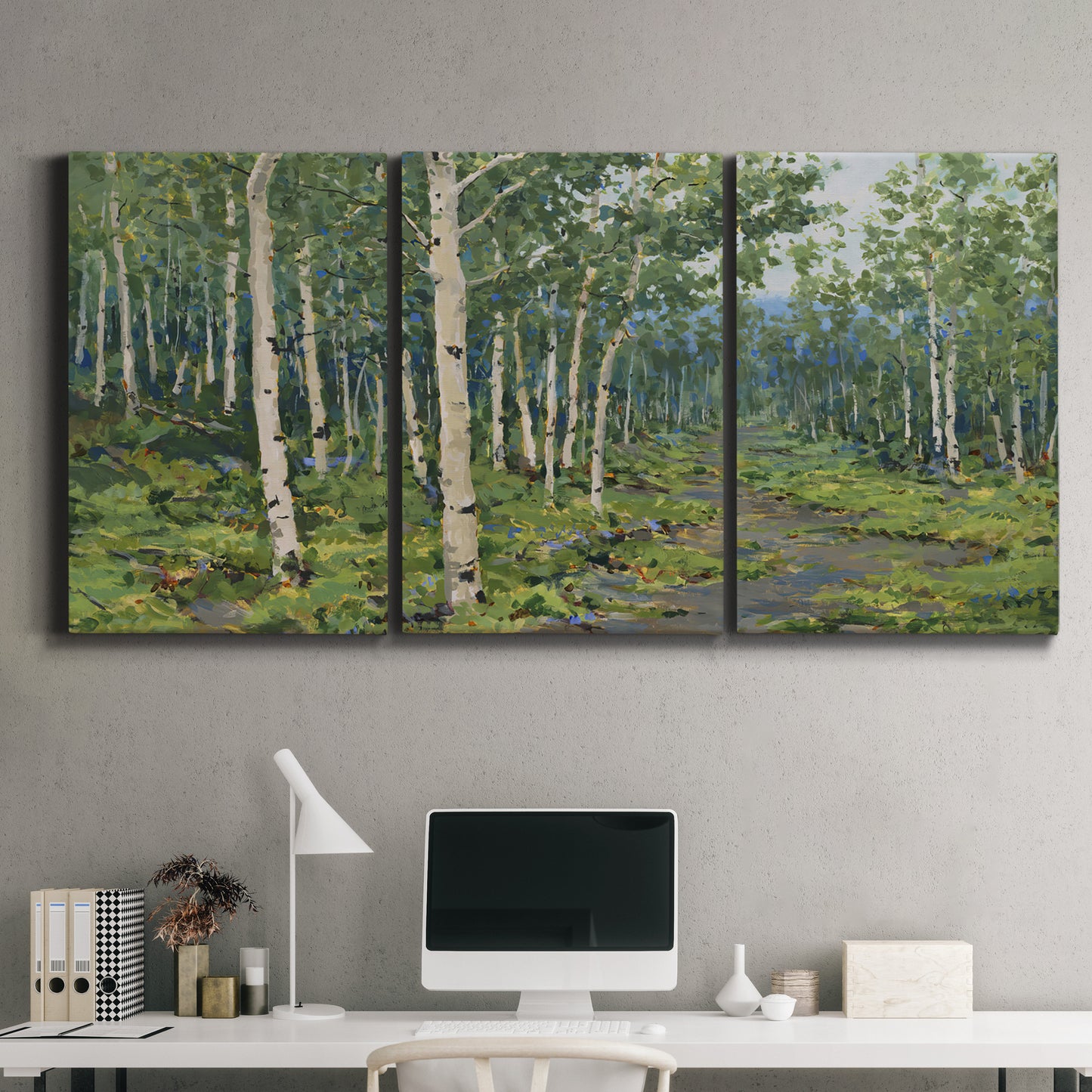 Three-panel canvas wall art featuring woodland forest scene with tall trees, displayed above a desk in a home office.