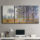 Three-panel canvas wall art featuring three poplar trees beside water, displayed above a desk in a home office.