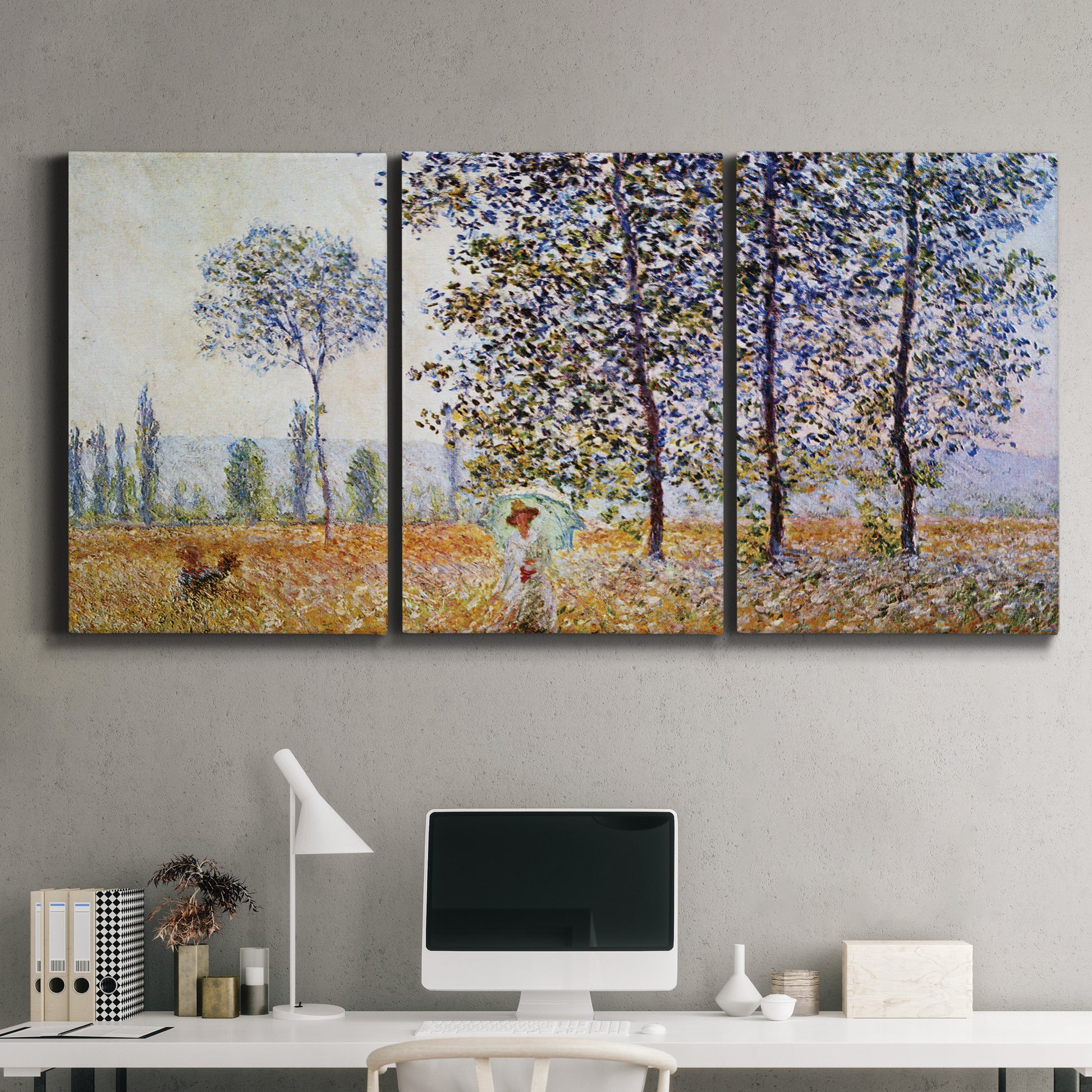 Three-panel canvas wall art featuring three poplar trees beside water, displayed above a desk in a home office.