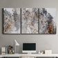 Three-panel canvas wall art featuring wooded trail through forest, displayed above a desk in a home office.