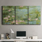 Three-panel canvas wall art featuring muted water lily pond, displayed above a desk in a home office.