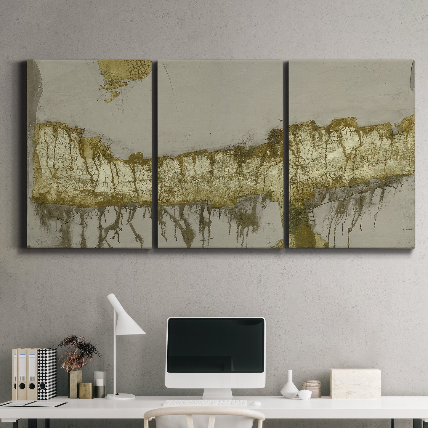 Three-panel canvas wall art featuring gold accented abstract ravine, displayed above a desk in a home office.
