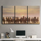 Three-panel canvas wall art featuring running horses captured in motion, displayed above a desk in a home office.