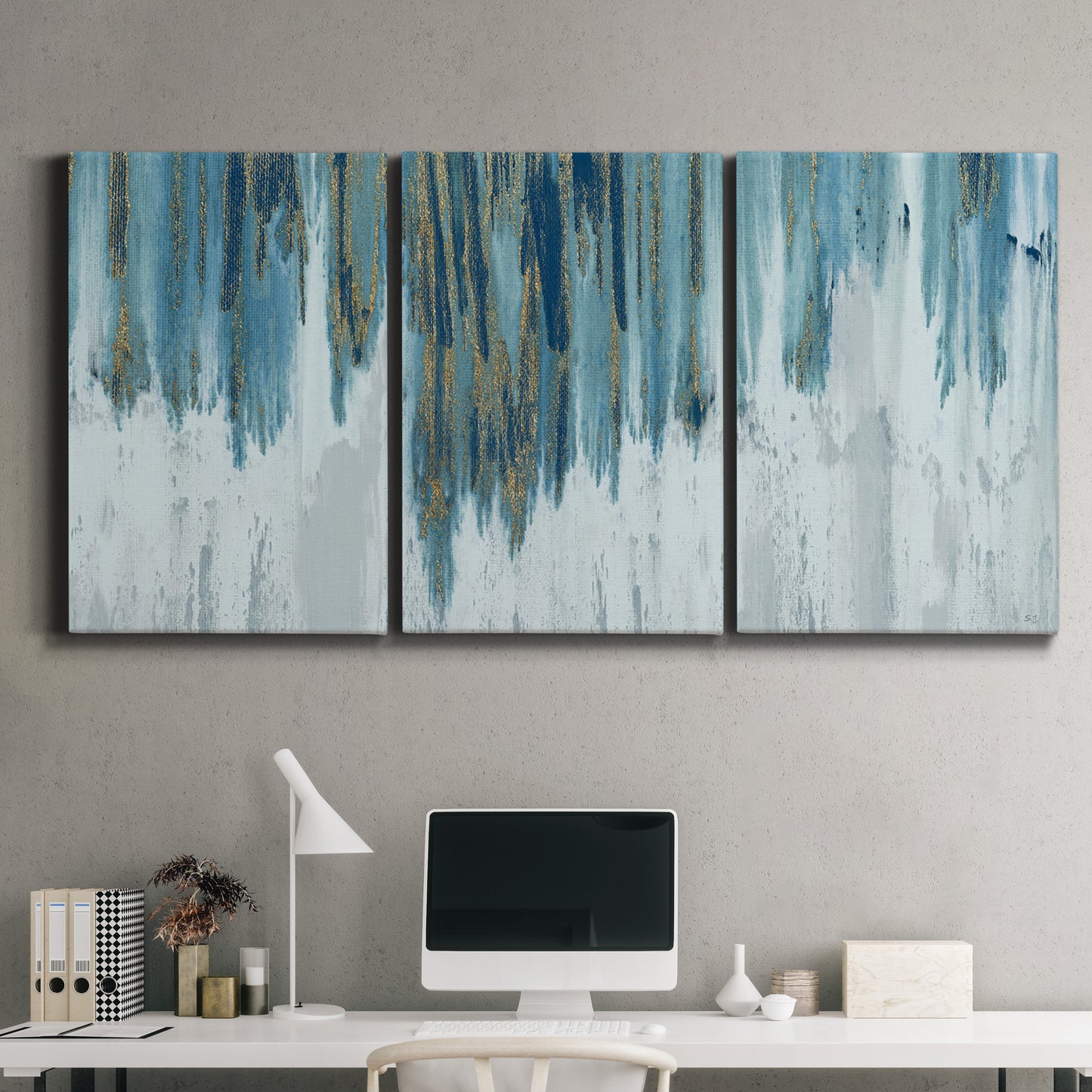 Three-panel canvas wall art featuring wide pastoral valley landscape, displayed above a desk in a home office.