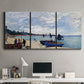 Three-panel canvas wall art featuring busy beach scene with shoreline, displayed above a desk in a home office.
