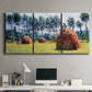 Three-panel canvas wall art featuring harvested grainstacks in field, displayed above a desk in a home office.