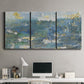 Three-panel canvas wall art featuring sparkling abstract sea surface, displayed above a desk in a home office.