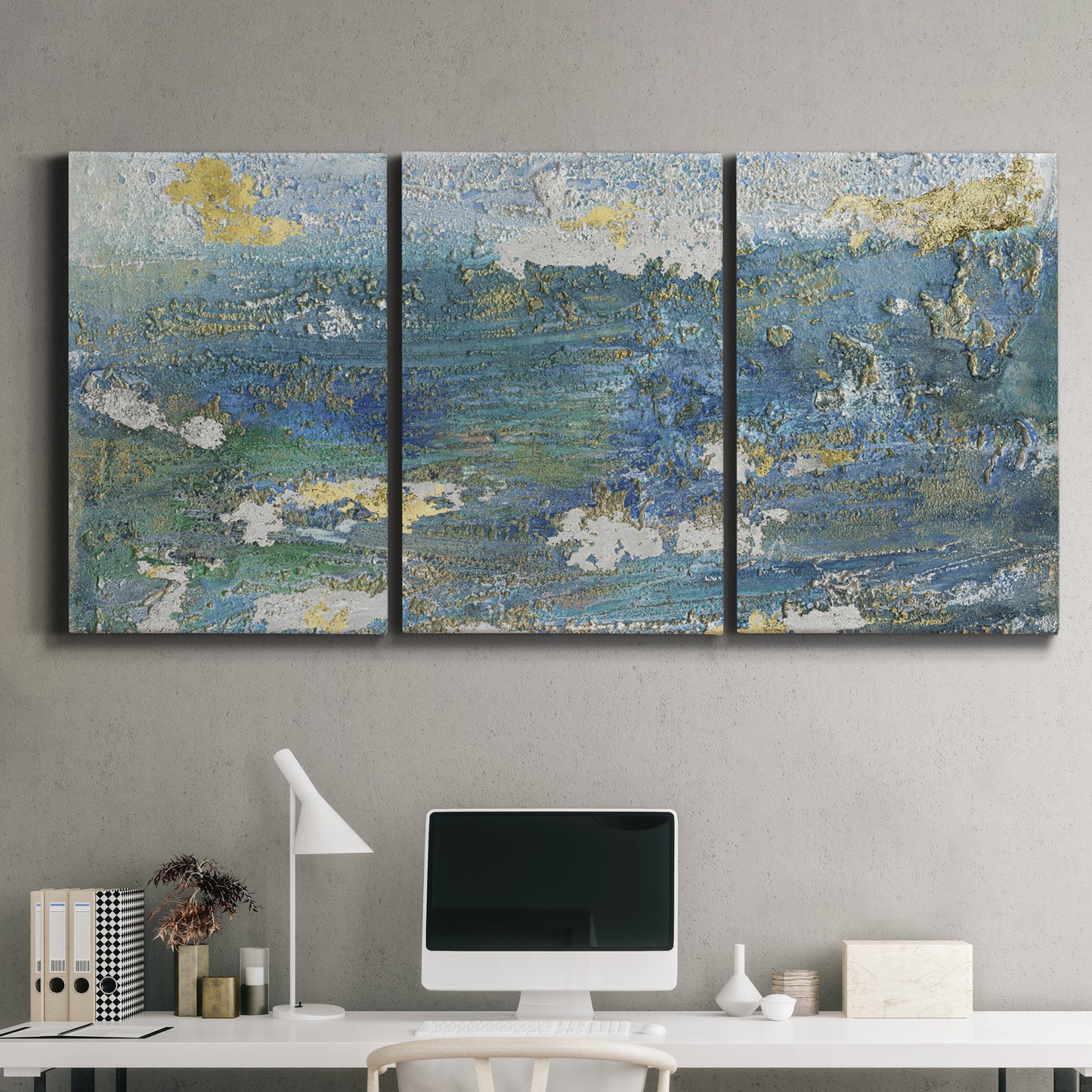 Three-panel canvas wall art featuring sparkling abstract sea surface, displayed above a desk in a home office.