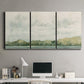 Three-panel canvas wall art featuring riverbank landscape with trees, displayed above a desk in a home office.