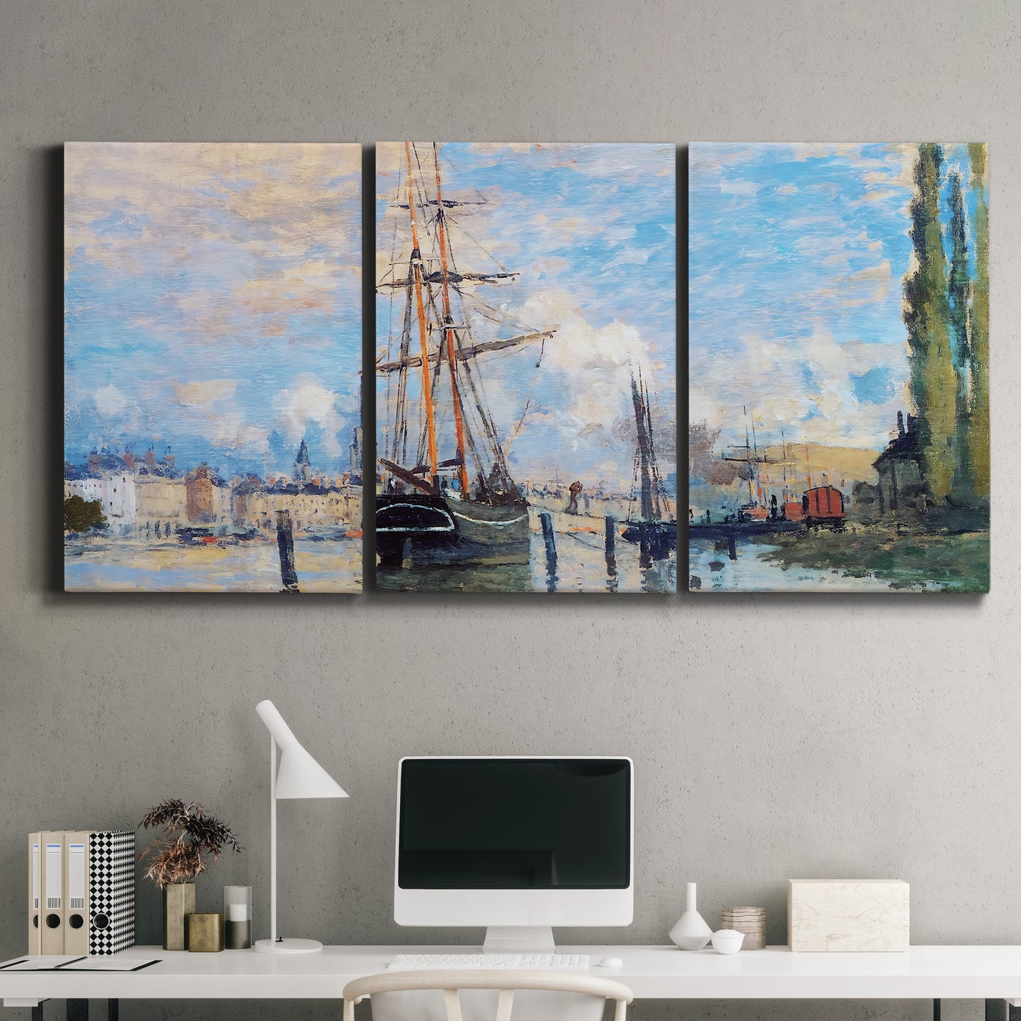 Three-panel canvas wall art featuring busy river port scene, displayed above a desk in a home office.