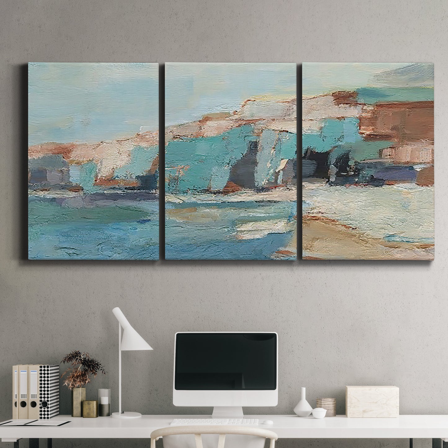 Three-panel canvas wall art featuring coastal shoreline with soft waves, displayed above a desk in a home office.
