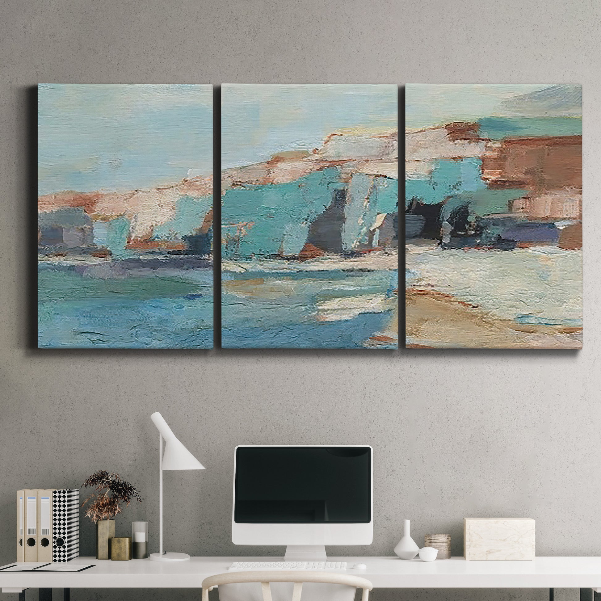 Three-panel canvas wall art featuring coastal shoreline with soft waves, displayed above a desk in a home office.