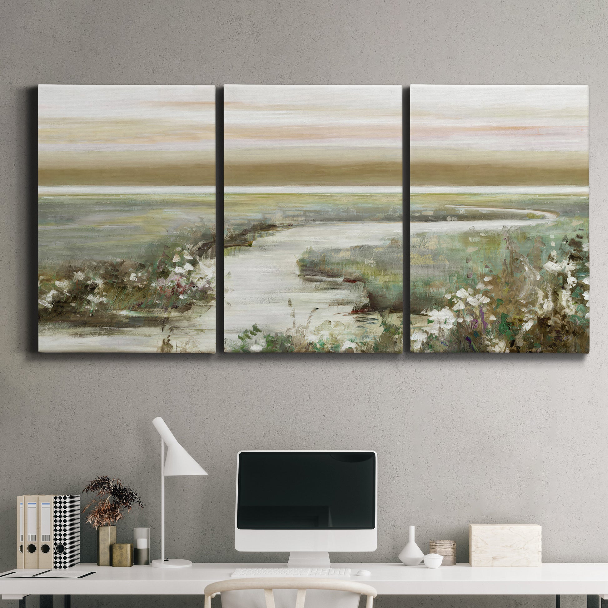 Three-panel canvas wall art featuring pastoral fields under soft sunrise, displayed above a desk in a home office.