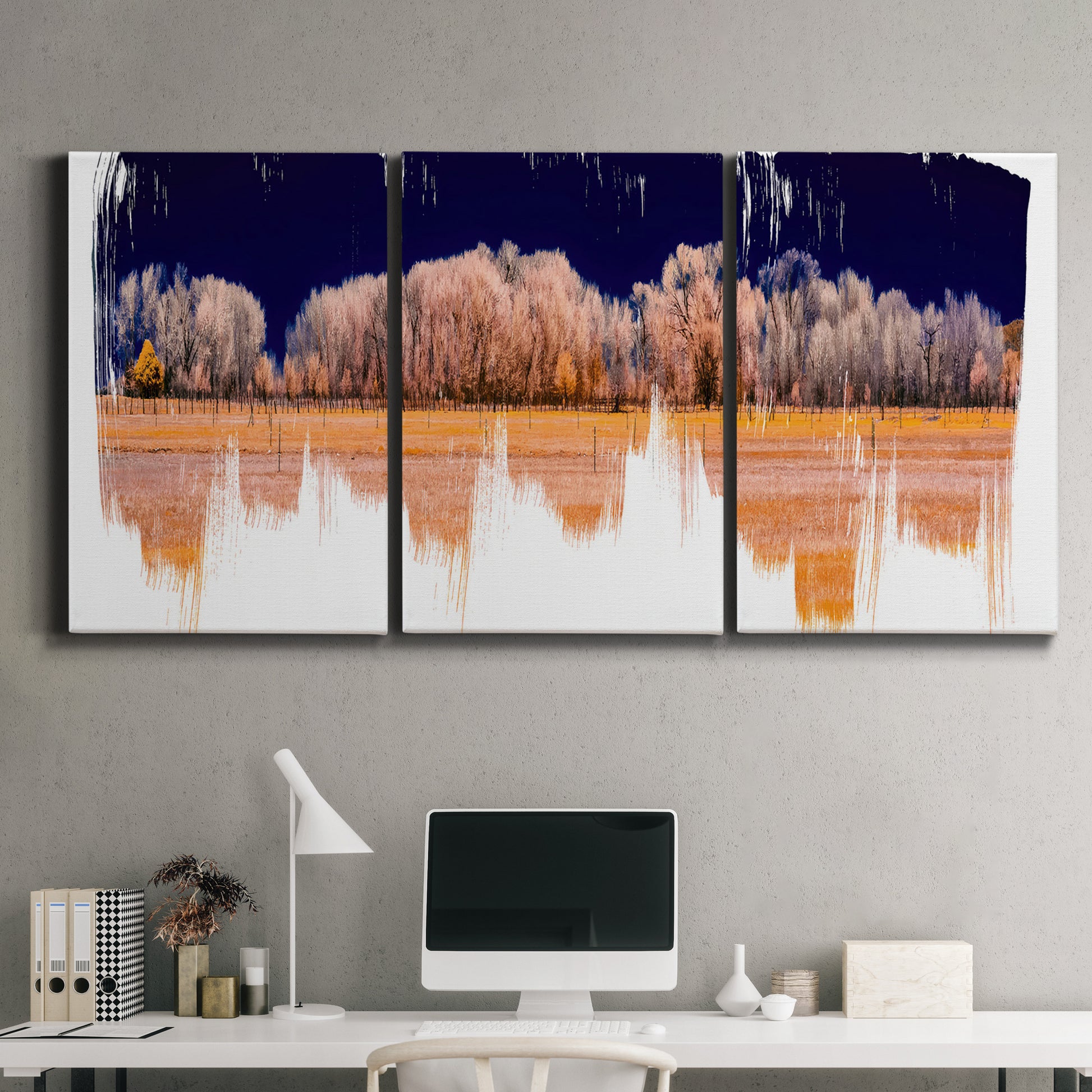 Three-panel canvas wall art featuring panoramic treeline landscape photograph, displayed above a desk in a home office.