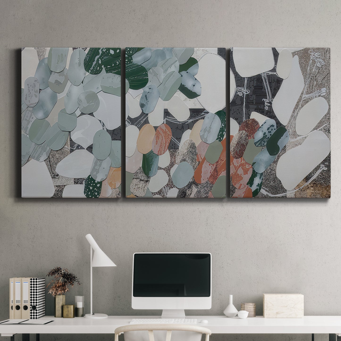 Three-panel canvas wall art featuring layered canyon inspired abstract forms, displayed above a desk in a home office.
