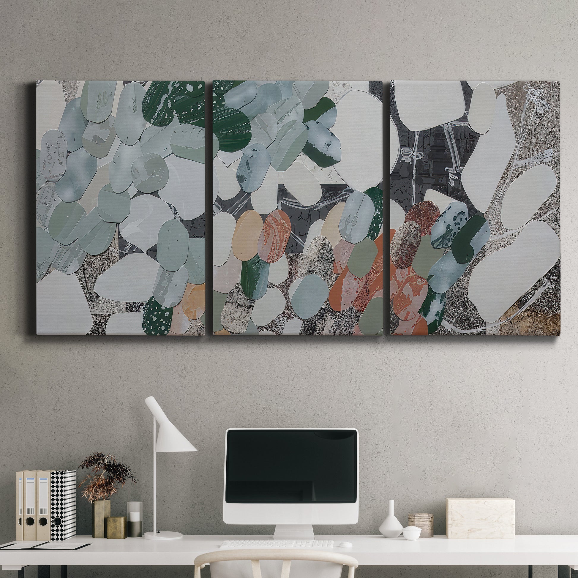 Three-panel canvas wall art featuring layered canyon inspired abstract forms, displayed above a desk in a home office.