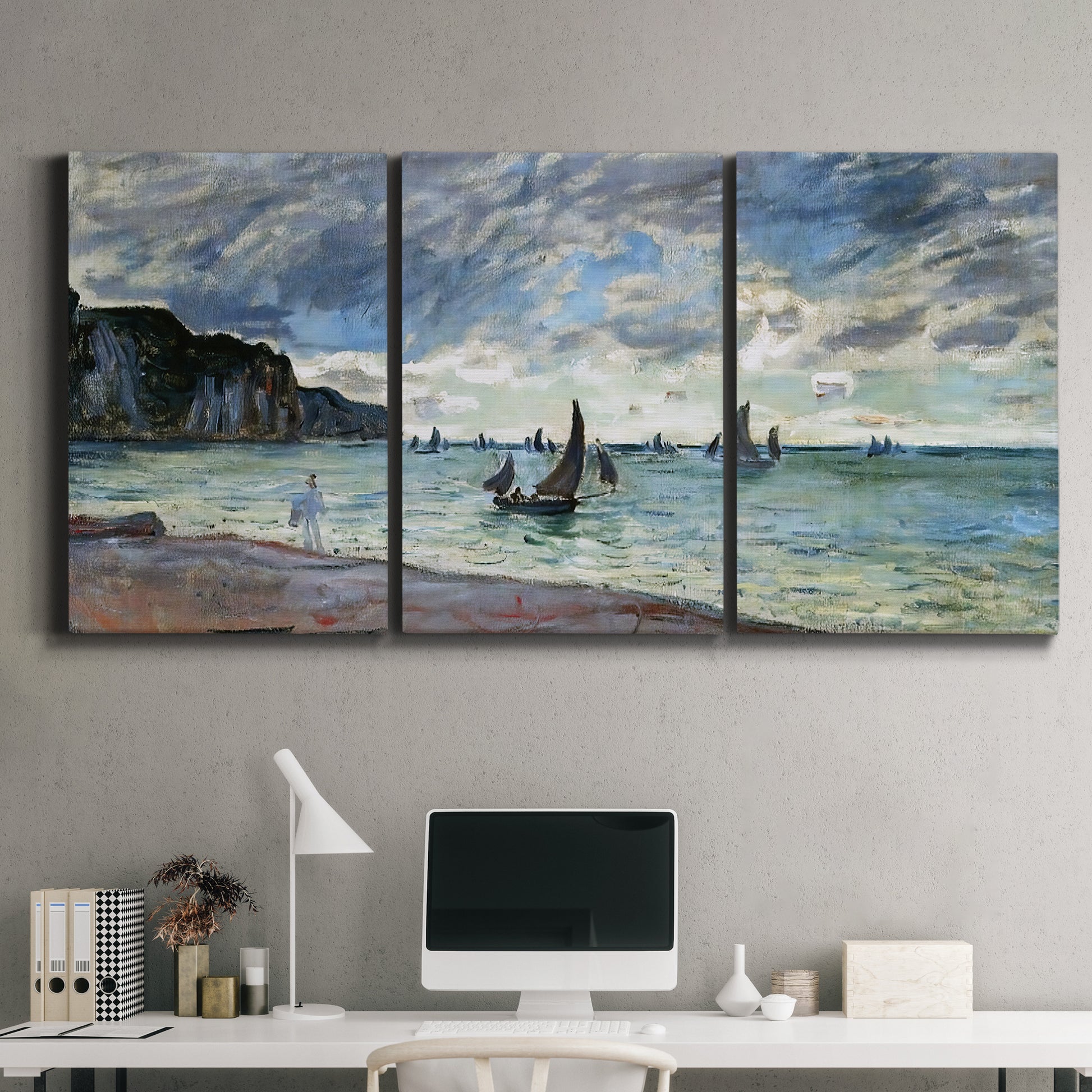 Three-panel canvas wall art featuring figures walking along sandy shoreline, displayed above a desk in a home office.