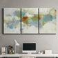 Three-panel canvas wall art featuring abstract suggestion of discovery, displayed above a desk in a home office.