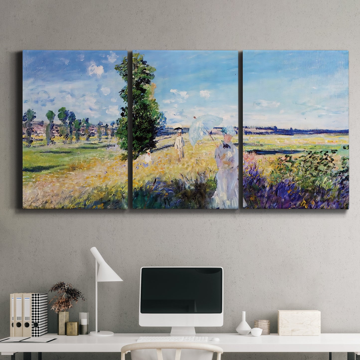 Three-panel canvas wall art featuring riverside path with figures, displayed above a desk in a home office.