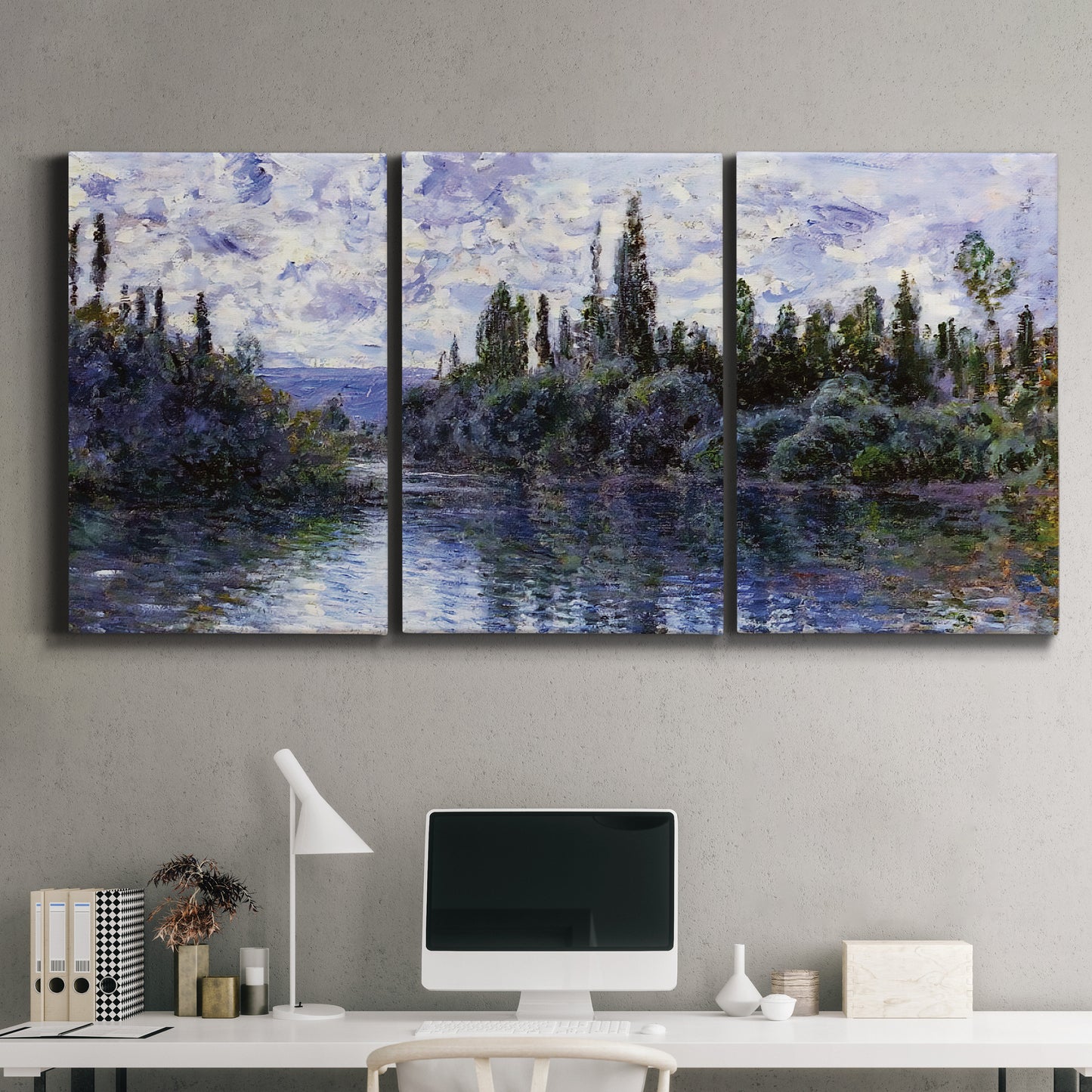 Three-panel canvas wall art featuring quiet river bend near village, displayed above a desk in a home office.