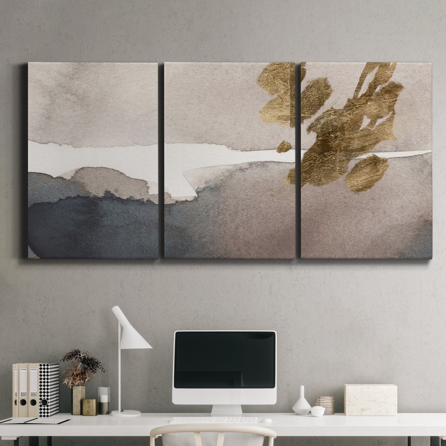 Three-panel canvas wall art featuring abstract watercolor with gold accents, displayed above a desk in a home office.