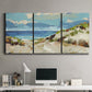 Three-panel canvas wall art featuring sand dunes beside open water, displayed above a desk in a home office.