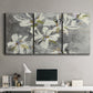 Three-panel canvas wall art featuring delicate floral symbolic arrangement, displayed above a desk in a home office.