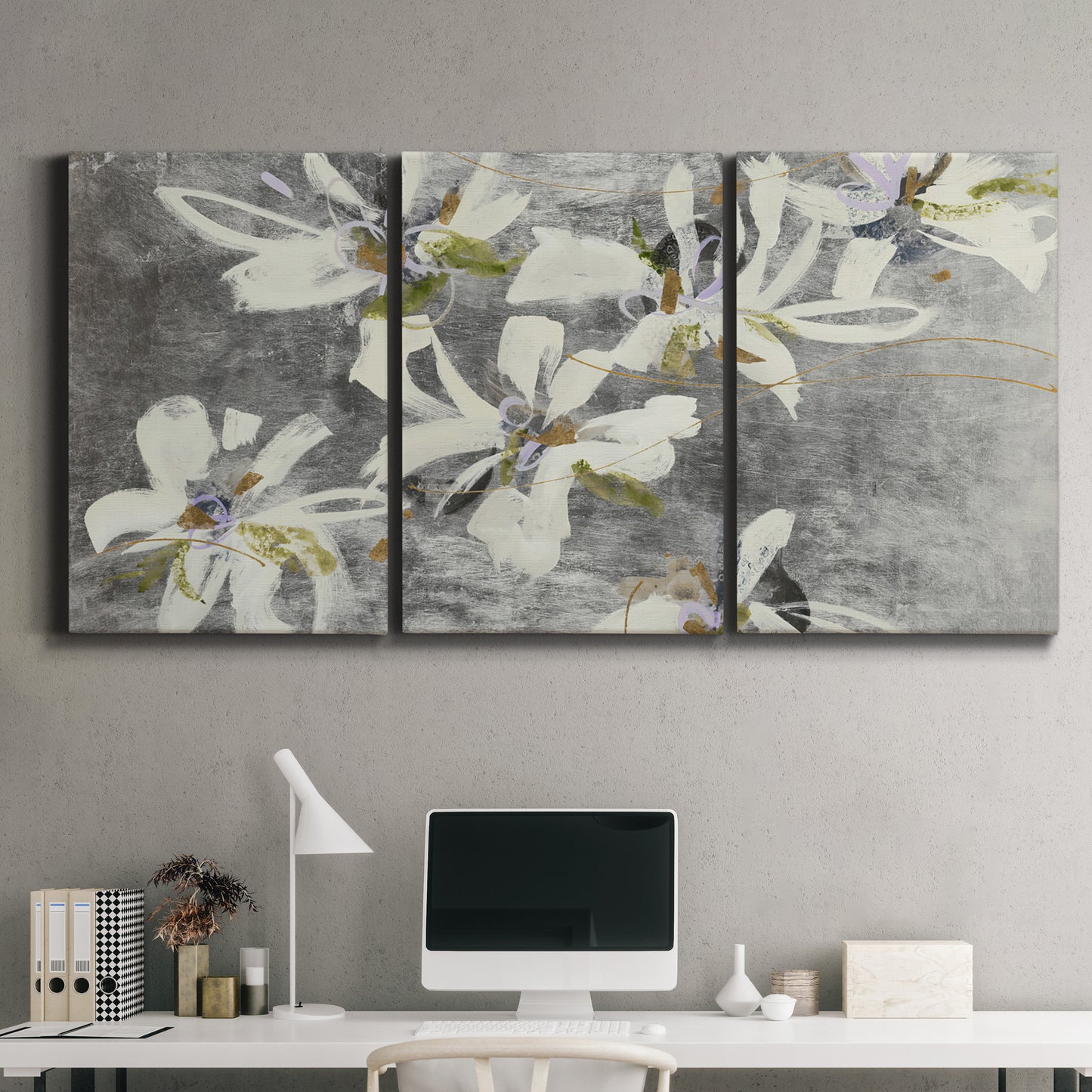 Three-panel canvas wall art featuring delicate floral symbolic arrangement, displayed above a desk in a home office.