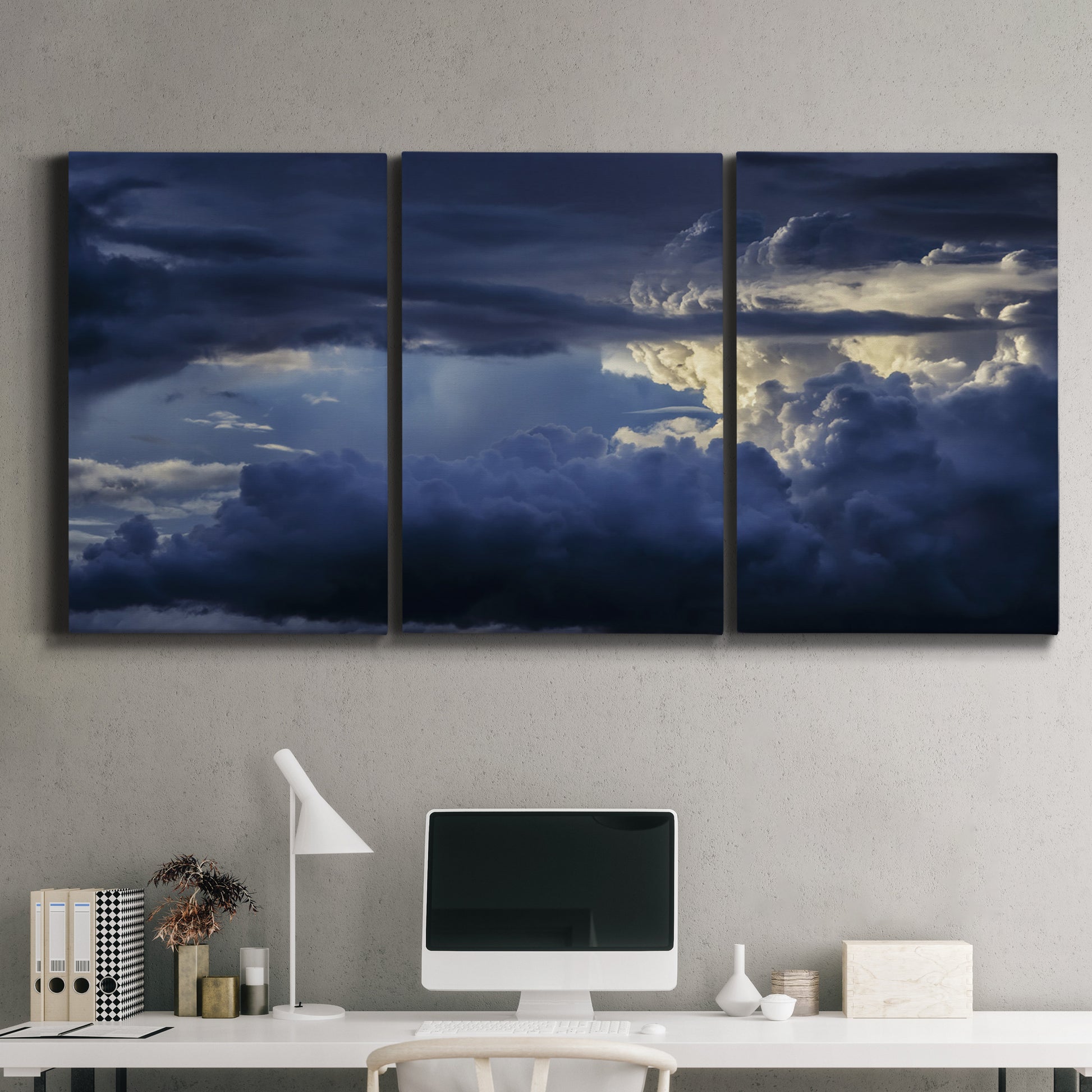 Three-panel canvas wall art featuring hot air balloons rising at dawn, displayed above a desk in a home office.