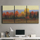 Three-panel canvas wall art featuring autumn landscape changing foliage, displayed above a desk in a home office.