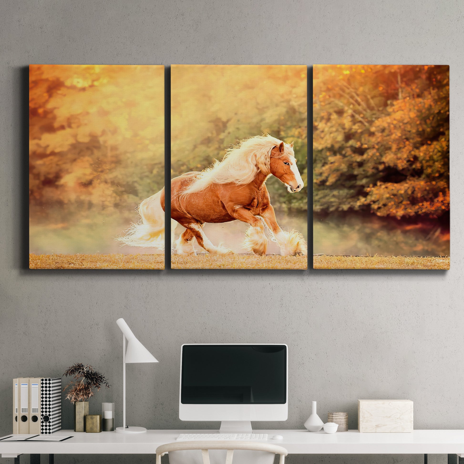 Three-panel canvas wall art featuring running horses captured in motion, displayed above a desk in a home office.