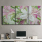 Three-panel canvas wall art featuring pink and white lilies botanical study, displayed above a desk in a home office.