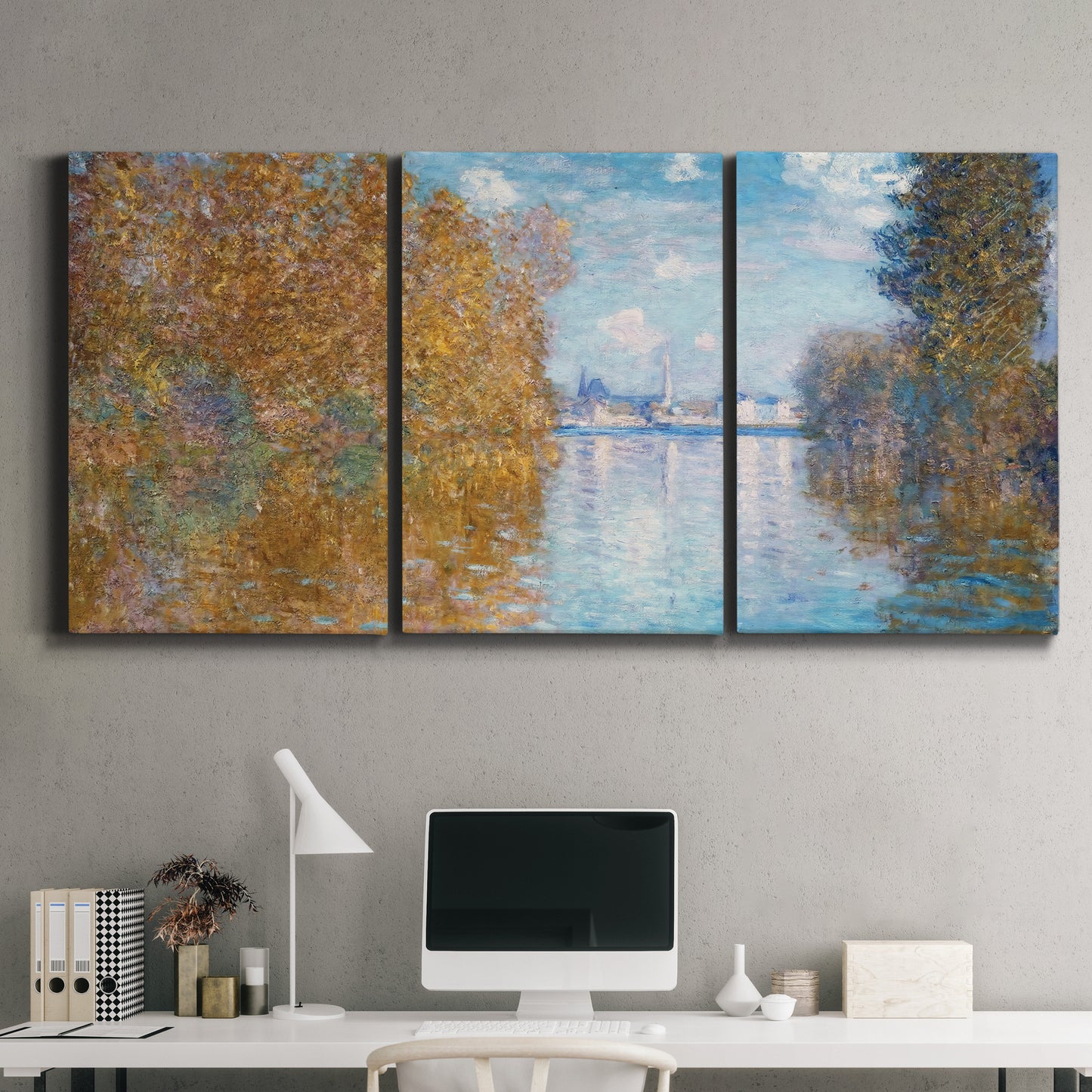 Three-panel canvas wall art featuring autumn landscape with glowing foliage, displayed above a desk in a home office.