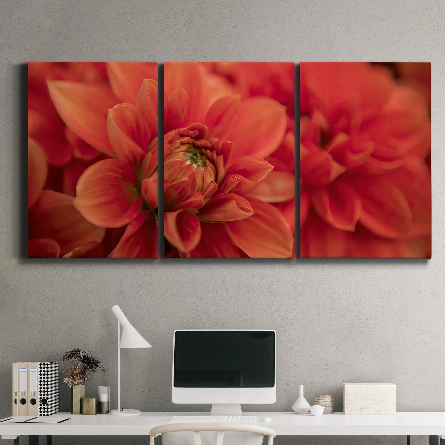 Three-panel canvas wall art featuring vivid red floral close up, displayed above a desk in a home office.