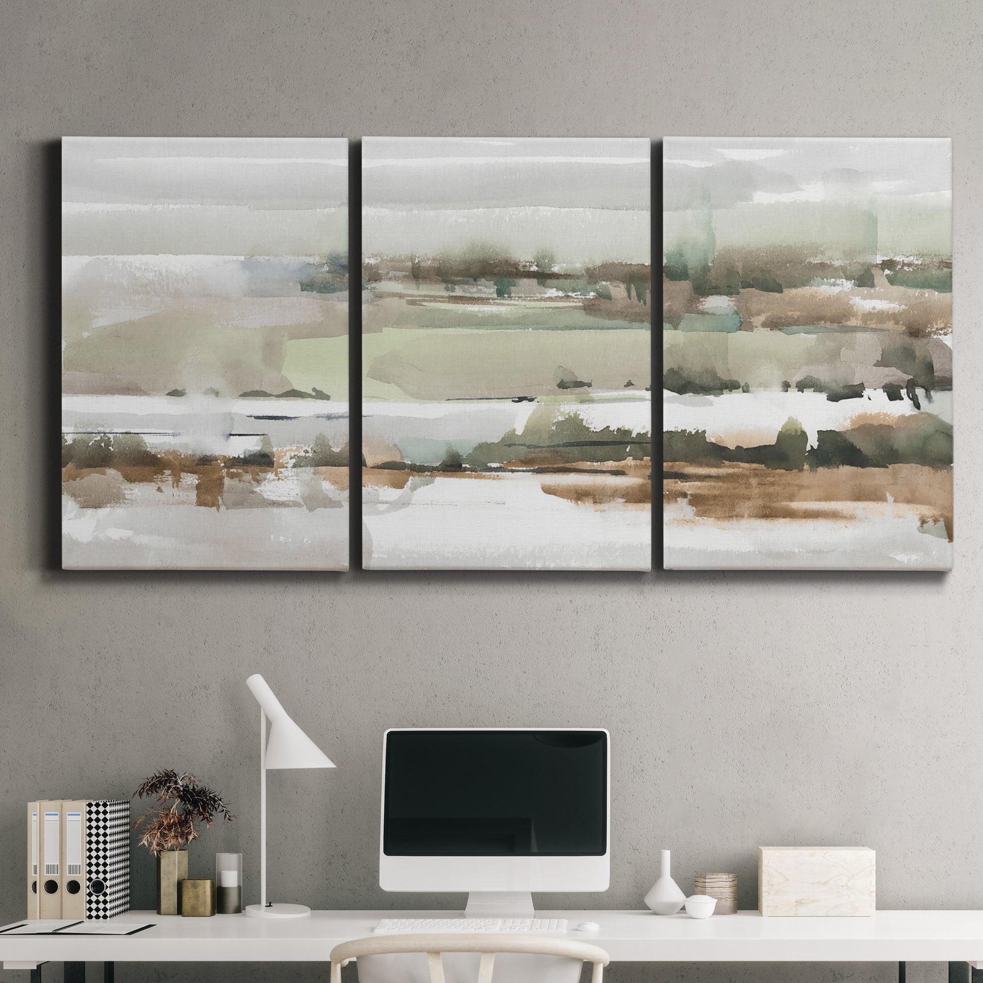 Three-panel canvas wall art featuring layered turquoise and earth tones abstract, displayed above a desk in a home office.