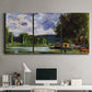 Three-panel canvas wall art featuring riverbank landscape near village, displayed above a desk in a home office.