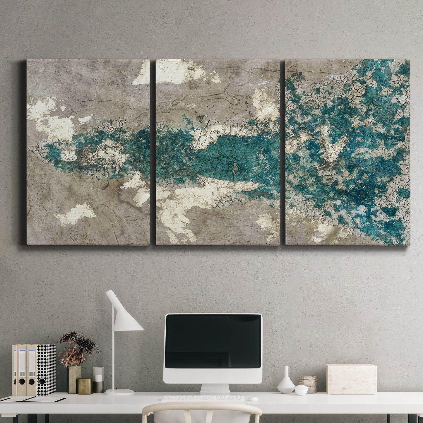 Three-panel canvas wall art featuring layered mineral abstract textures, displayed above a desk in a home office.