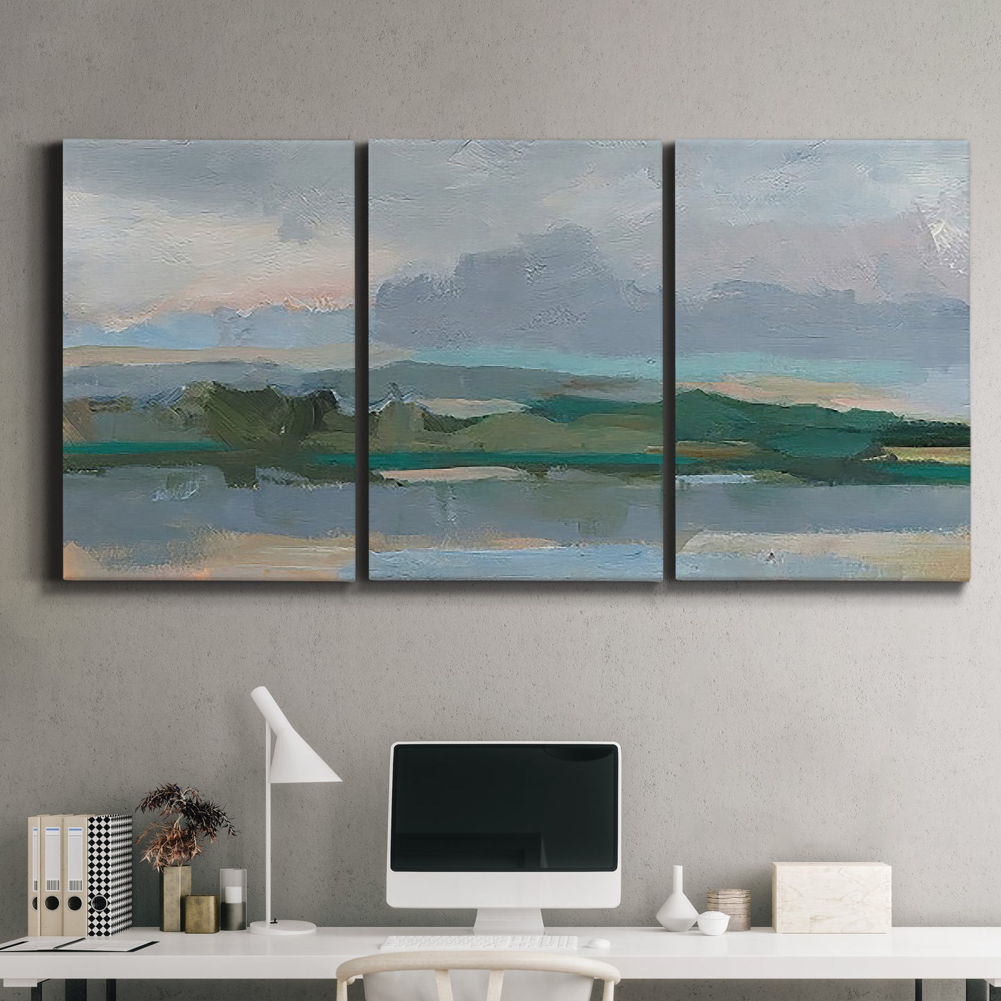 Three-panel canvas wall art featuring twilight landscape with fading light, displayed above a desk in a home office.