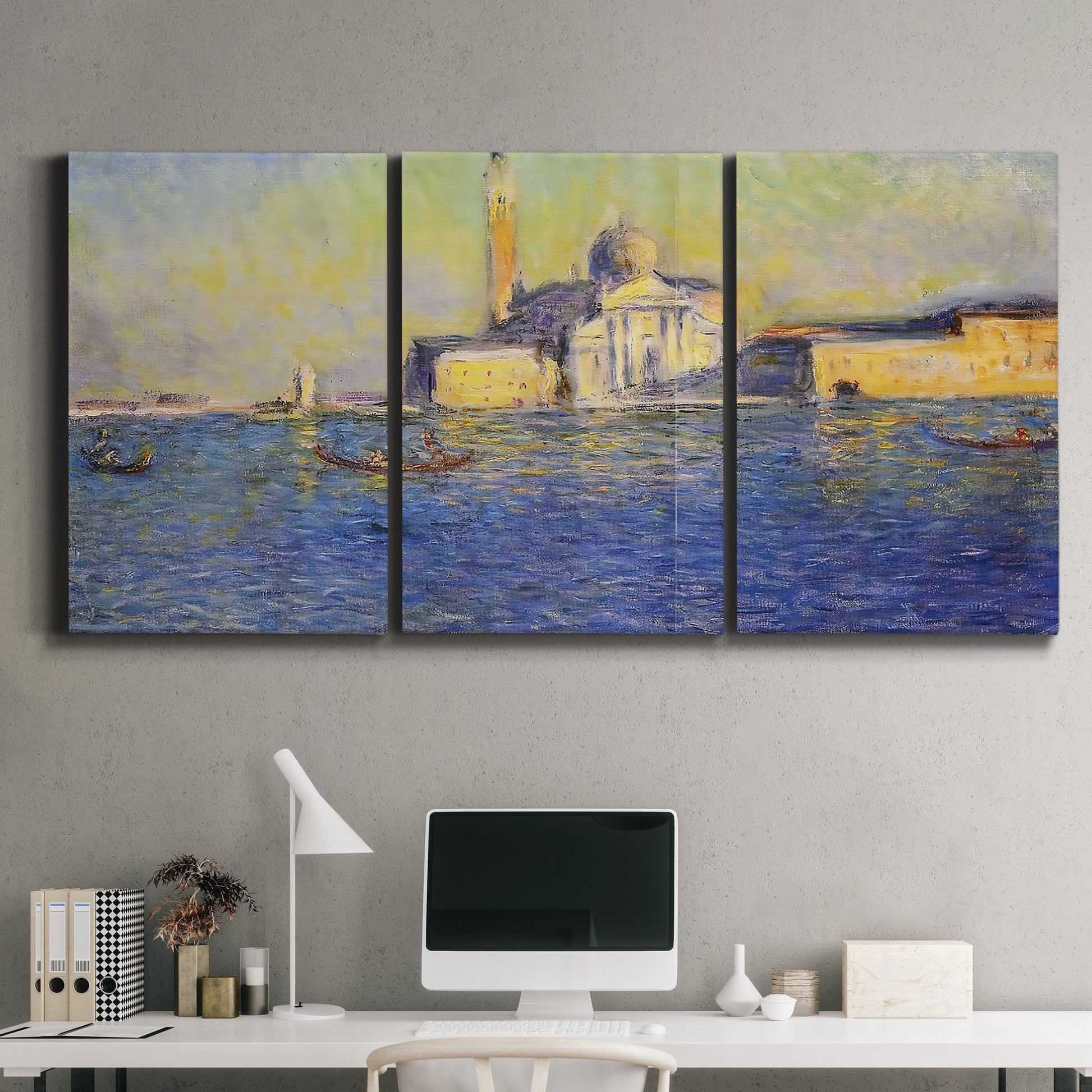 Three-panel canvas wall art featuring layered modern abstract color ribbons, displayed above a desk in a home office.