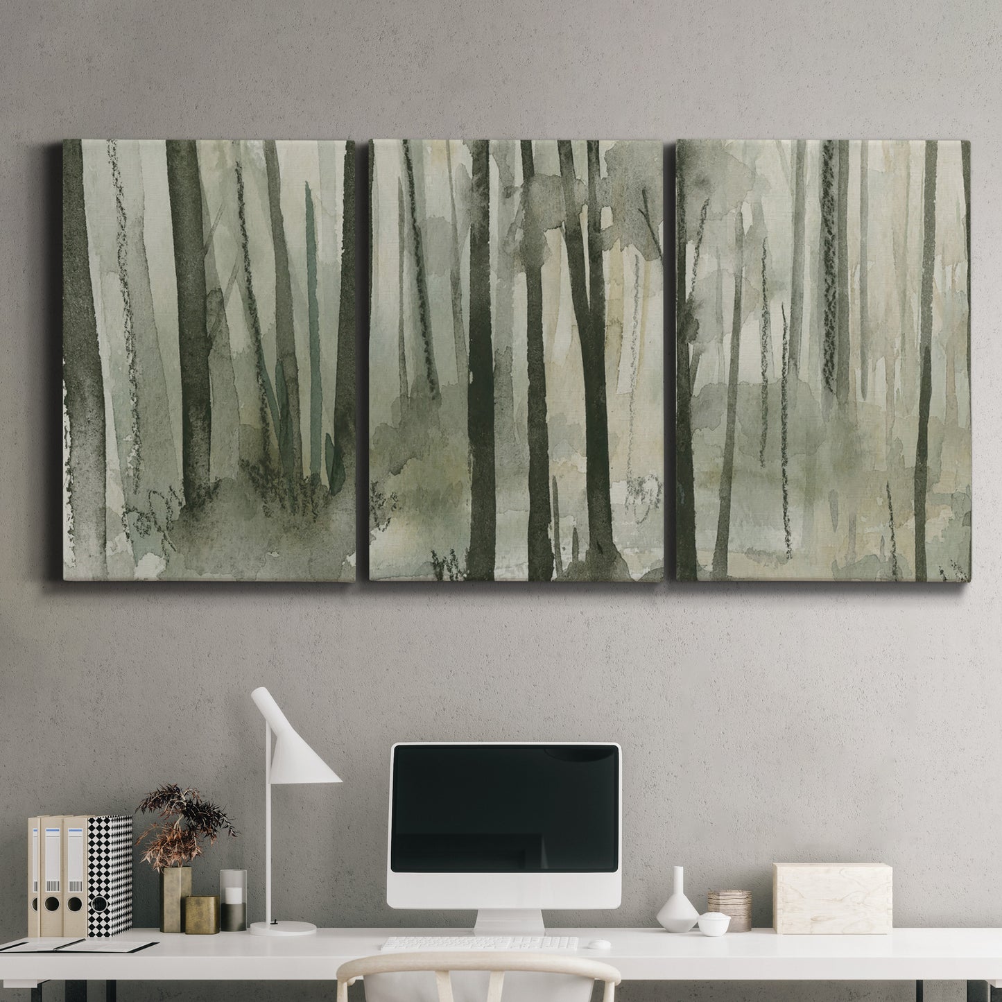 Three-panel canvas wall art featuring wooded forest path watercolor, displayed above a desk in a home office.