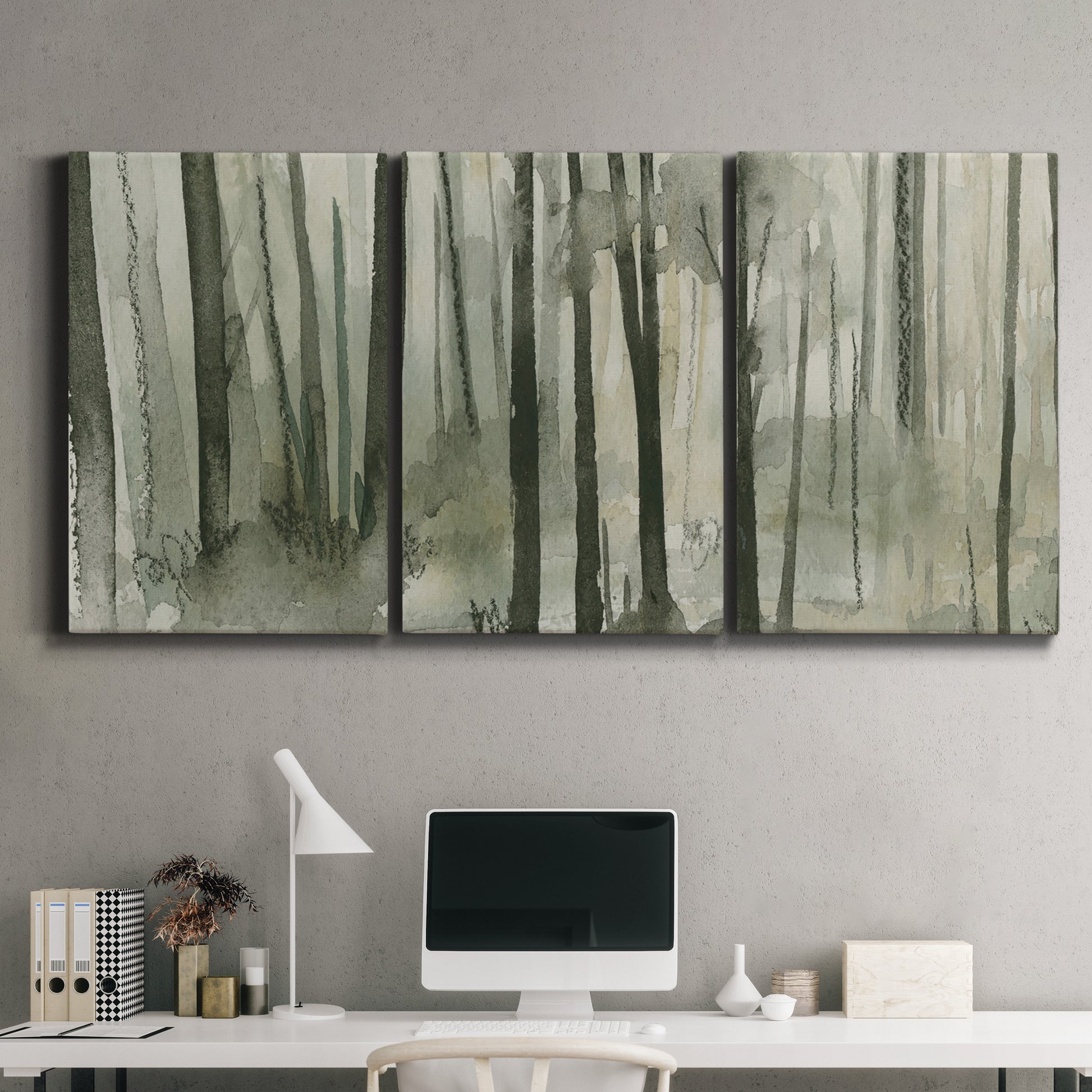 Three-panel canvas wall art featuring wooded forest path watercolor, displayed above a desk in a home office.