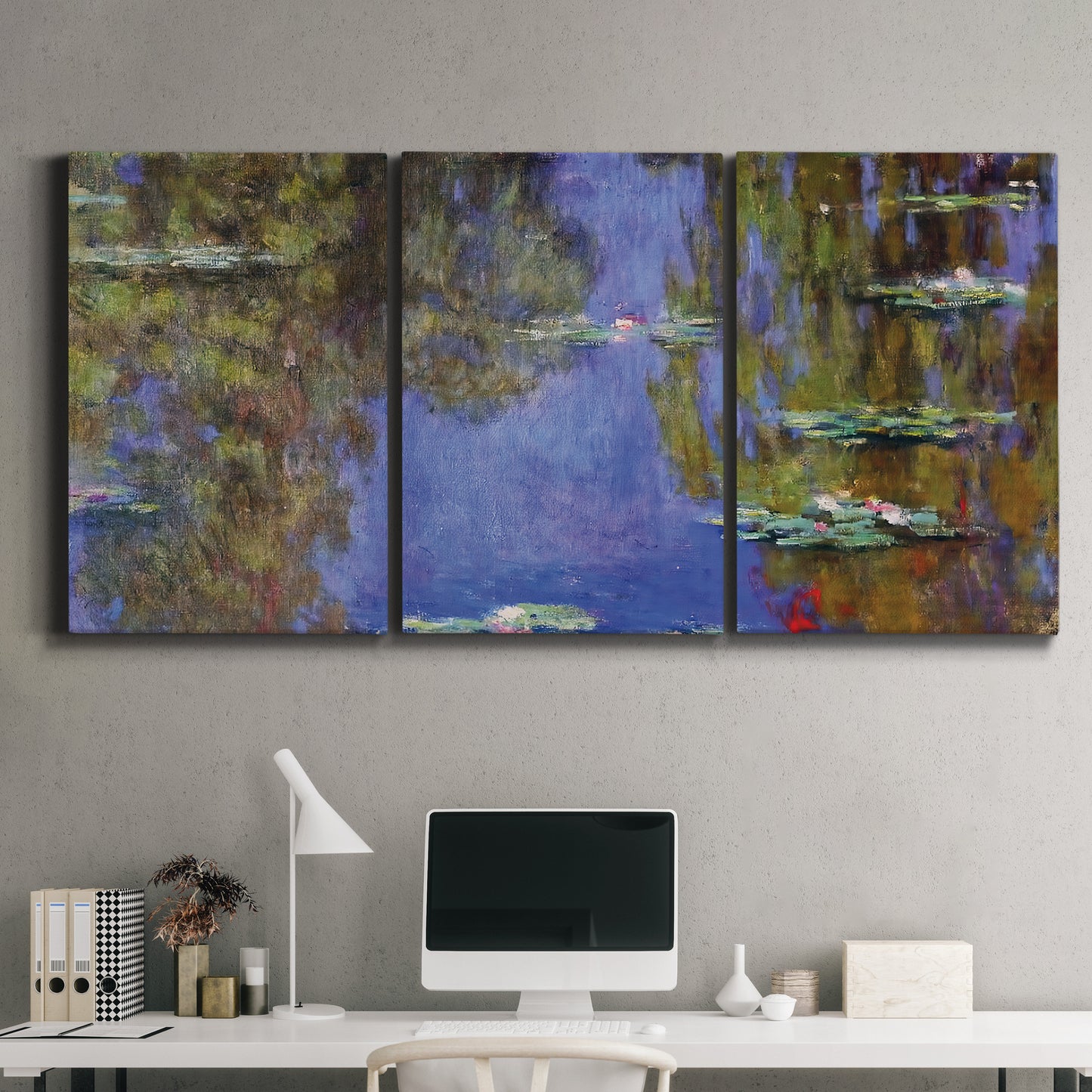 Three-panel canvas wall art featuring blue and purple water lily pond, displayed above a desk in a home office.