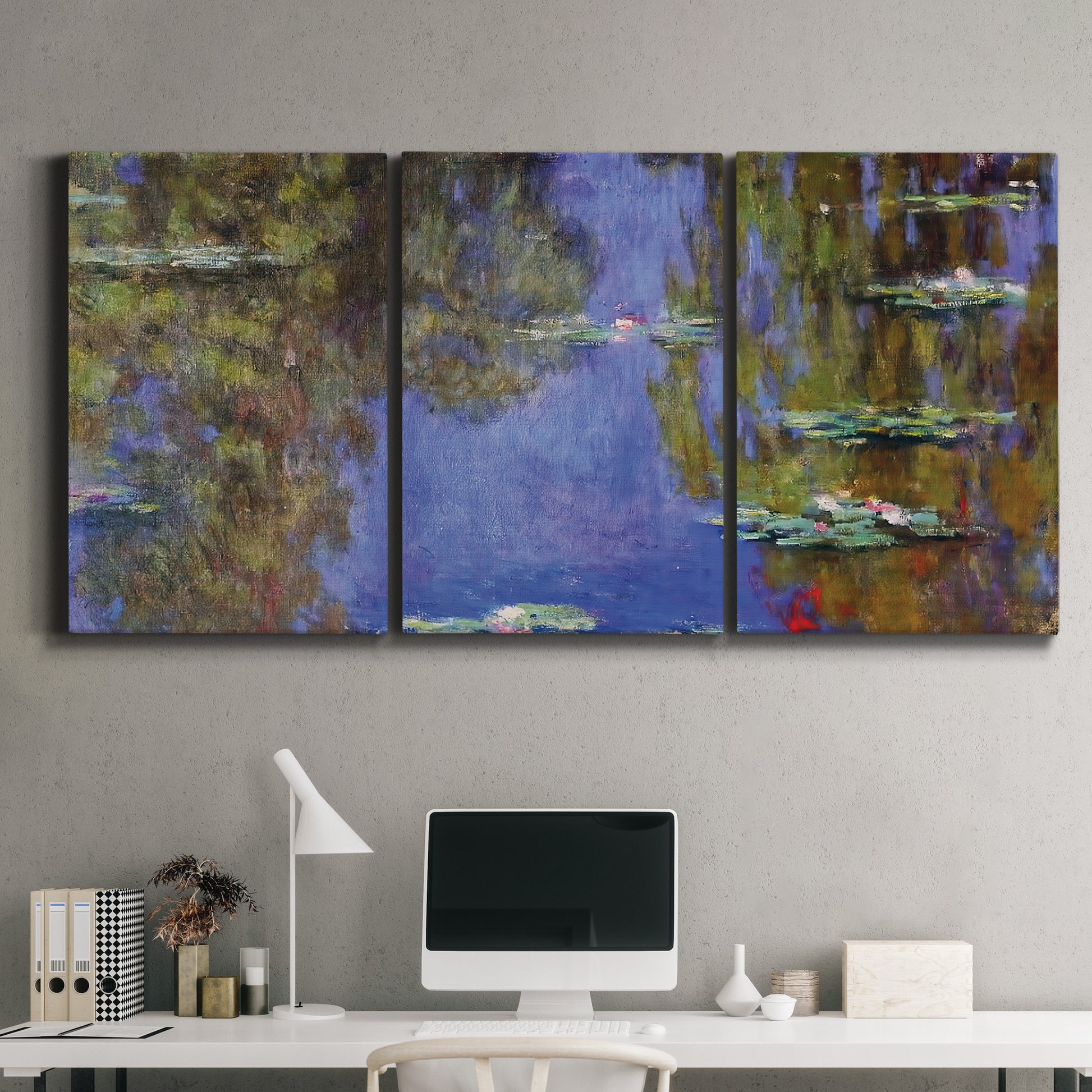 Three-panel canvas wall art featuring blue and purple water lily pond, displayed above a desk in a home office.