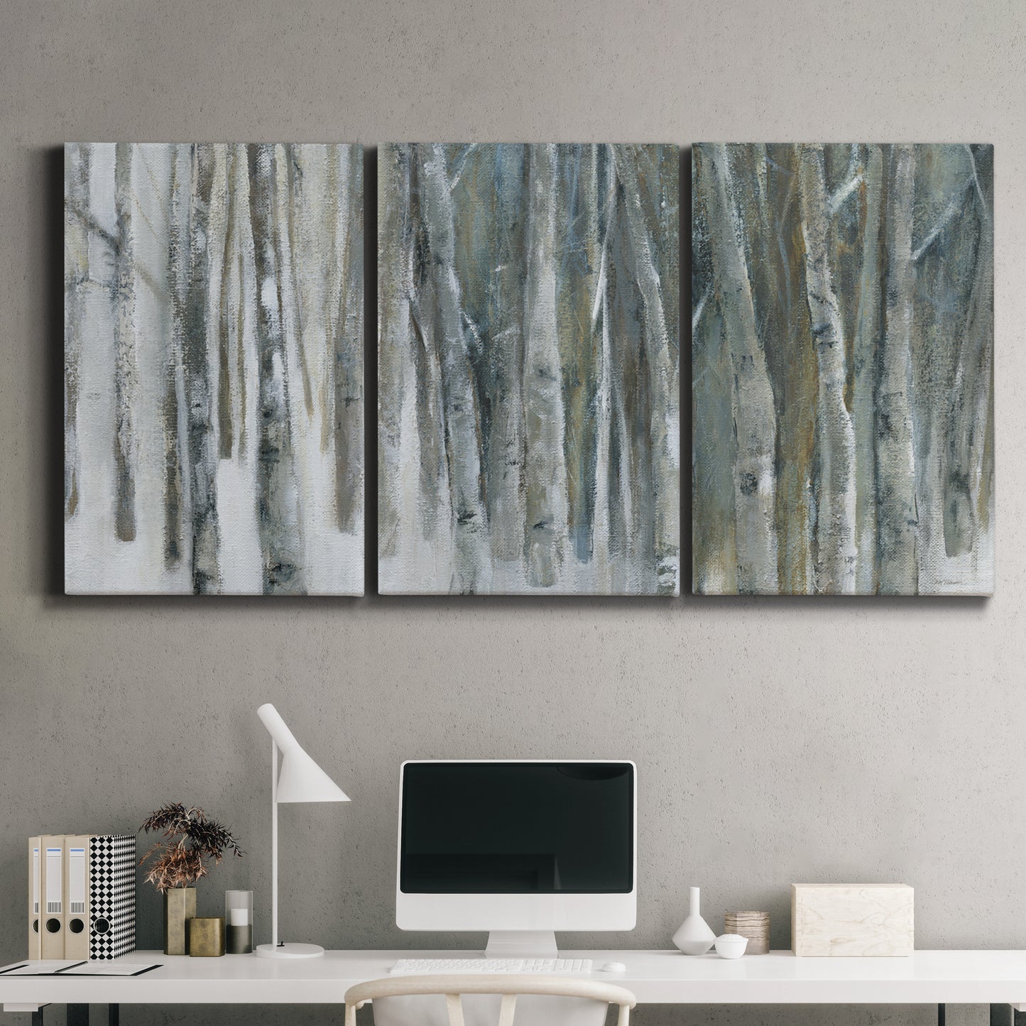 Three-panel canvas wall art featuring abstract birch forest landscape, displayed above a desk in a home office.