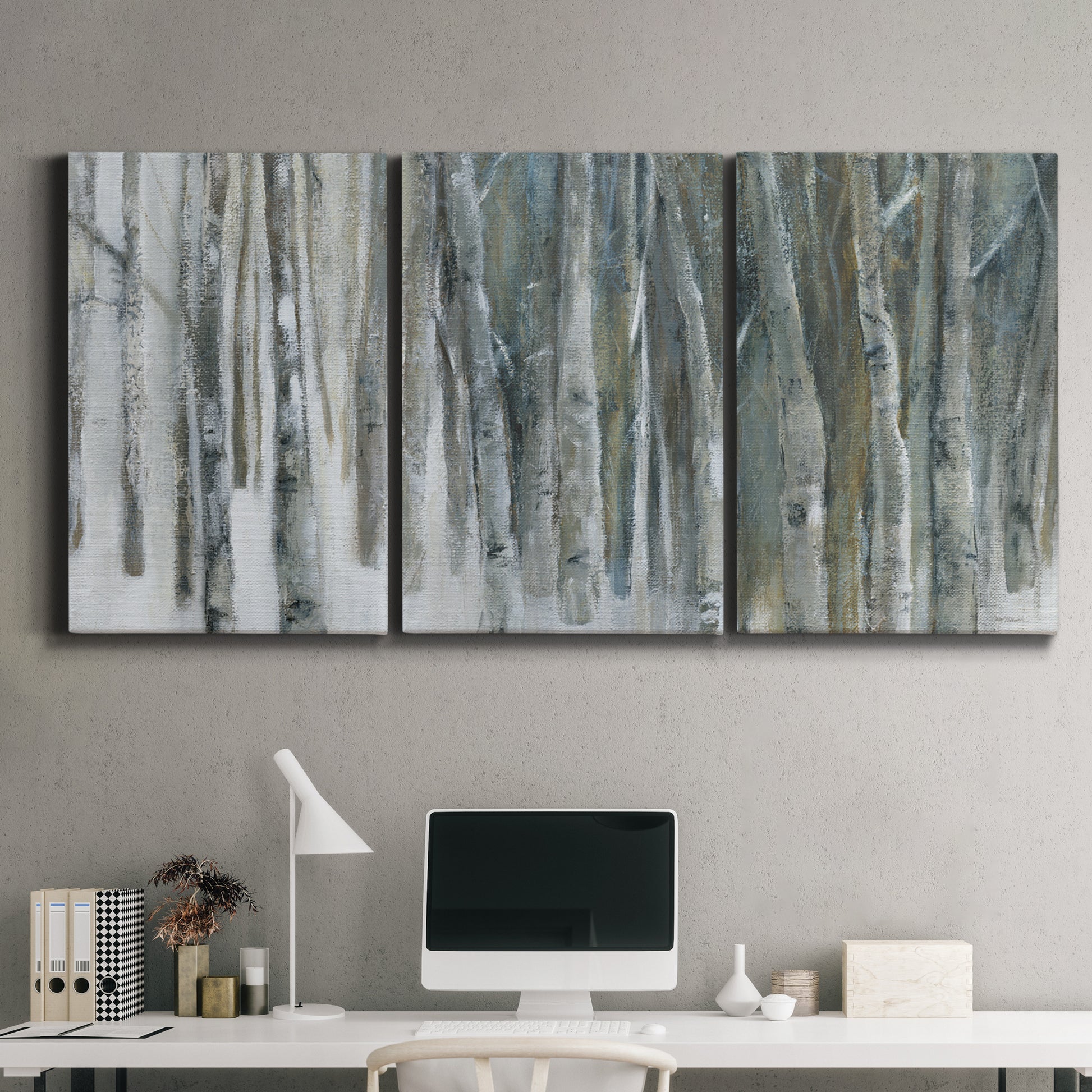 Three-panel canvas wall art featuring abstract birch forest landscape, displayed above a desk in a home office.