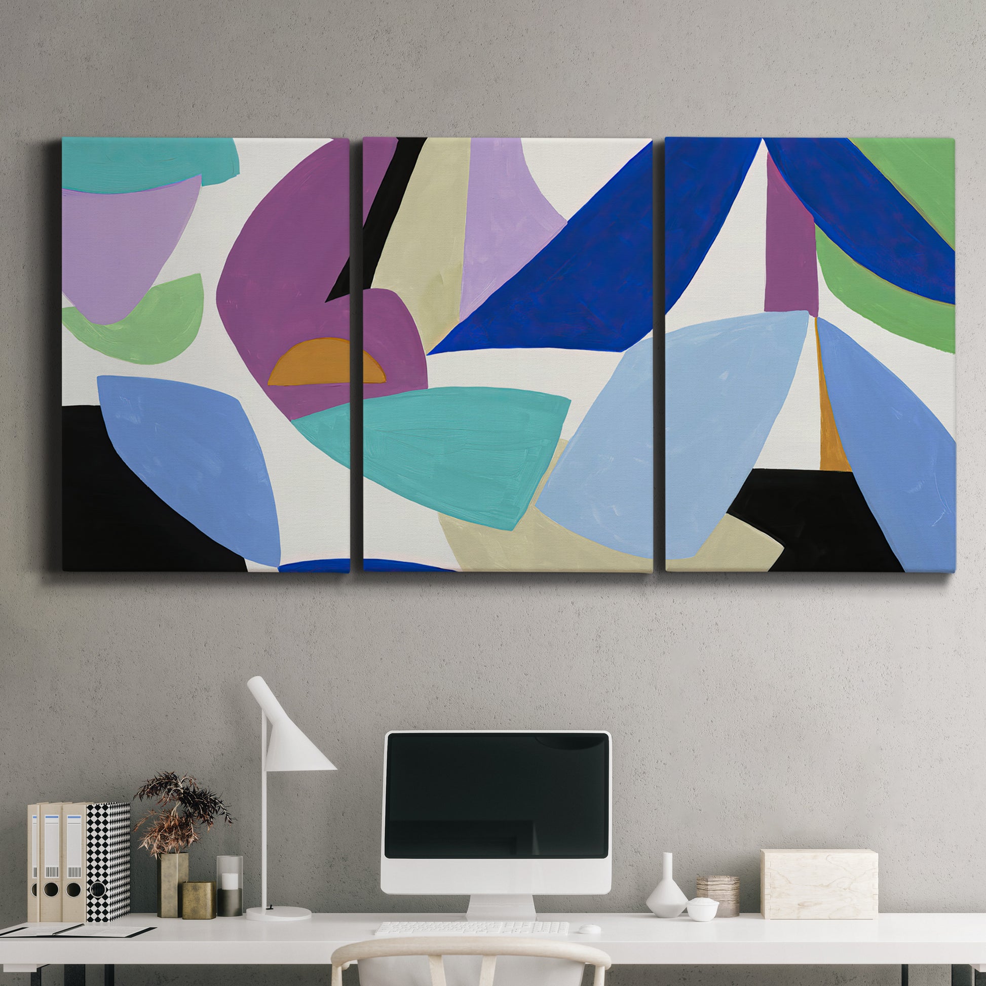 Three-panel canvas wall art featuring colorful abstract homage to modernism, displayed above a desk in a home office.